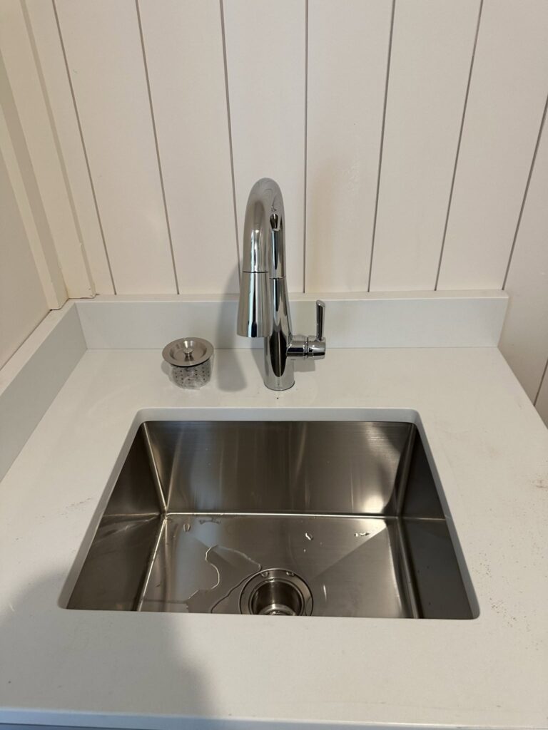 Newly installed bathroom sink and mixer faucet