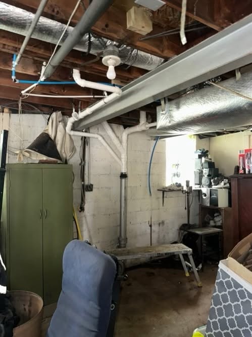 Rough-in plumbing pipework in an unfinished basement