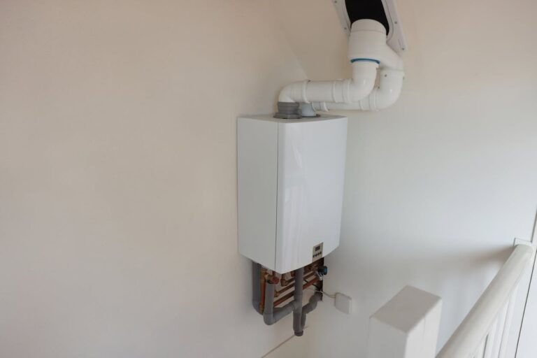Wall-mounted tankless water heater unit
